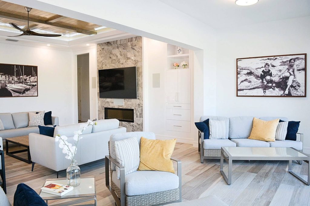 Naples condo living room renovation with stone fireplace surround